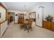 Cozy dining room featuring a wooden table set with seating for four and a china cabinet at 7632 Sea Crest N Way, Noblesville, IN 46062