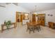 Dining area with wooden table and chairs, connecting to the kitchen through a serving hatch at 7632 Sea Crest N Way, Noblesville, IN 46062
