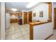 Cozy kitchen with white appliances, wooden cabinets, and a view into the dining area at 7632 Sea Crest N Way, Noblesville, IN 46062