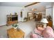 Spacious living room with neutral carpet, ceiling fan and comfortable furnishings at 7632 Sea Crest N Way, Noblesville, IN 46062