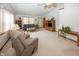 Bright and airy living room featuring a vaulted ceiling, neutral carpet, and ample seating at 7632 Sea Crest N Way, Noblesville, IN 46062