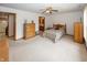 Spacious main bedroom with wood furniture, soft carpet, and neutral paint at 7632 Sea Crest N Way, Noblesville, IN 46062