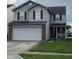 Charming two-story home featuring vinyl siding, red shutters, and an attached two-car garage at 8056 Maple Stream Blvd, Indianapolis, IN 46217