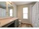 Bright bathroom with a spacious vanity, sink, toilet, and shower/tub combination at 8148 Gathering Cir, Indianapolis, IN 46259