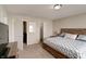 A comfortable bedroom features a queen bed, neutral walls, and plush carpeting at 8148 Gathering Cir, Indianapolis, IN 46259