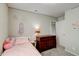 Comfortable bedroom with a twin bed, dresser, and neutral tones at 8148 Gathering Cir, Indianapolis, IN 46259