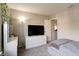 Bright bedroom with carpet, a dresser, decorative ivy, a mirror, and a lamp at 8148 Gathering Cir, Indianapolis, IN 46259