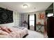 Cozy bedroom adorned with creative decorations, comfortable bed, and natural light at 8148 Gathering Cir, Indianapolis, IN 46259