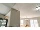 Bright dining room with wood furniture, decorative lighting, and sliding glass doors overlooking a serene pond at 8148 Gathering Cir, Indianapolis, IN 46259