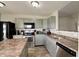 Modern kitchen with gray cabinets, stainless steel appliances, and an eat-in island at 8148 Gathering Cir, Indianapolis, IN 46259