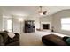Inviting living room features a brick fireplace, comfortable seating, and natural light at 8148 Gathering Cir, Indianapolis, IN 46259