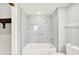 Bathroom featuring stylish marble tiled shower and tub at 8545 La Corrida Ct, Indianapolis, IN 46227