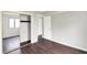 Bedroom with dark wood floors, large window, and mirrored closet at 8545 La Corrida Ct, Indianapolis, IN 46227