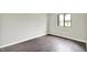 Empty bedroom with light gray walls, hardwood floors and natural light at 8545 La Corrida Ct, Indianapolis, IN 46227