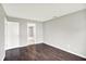 Bedroom with dark wood floors and a partial view of an adjacent bathroom at 8545 La Corrida Ct, Indianapolis, IN 46227