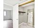 Bedroom with wood floors, gray walls, door to closet with mirror and hanging rod at 8545 La Corrida Ct, Indianapolis, IN 46227