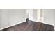 Bedroom with dark wood floors and a partial view of an adjacent bathroom at 8545 La Corrida Ct, Indianapolis, IN 46227