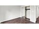 Bedroom with dark wood floors and sliding closet with mirrored doors at 8545 La Corrida Ct, Indianapolis, IN 46227