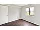Bedroom with dark wood floors and a bright sunny window at 8545 La Corrida Ct, Indianapolis, IN 46227
