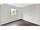 Bedroom with dark wood floors, gray walls, and bright natural light at 8545 La Corrida Ct, Indianapolis, IN 46227