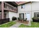 Charming townhouse with a front patio, wooden balcony, and well-maintained landscaping at 8545 La Corrida Ct, Indianapolis, IN 46227