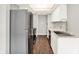 Bright kitchen with stainless steel appliances, white cabinets, and dark hardwood floors at 8545 La Corrida Ct, Indianapolis, IN 46227