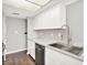 Well-lit kitchen featuring stainless steel appliances, white cabinets, and marble countertops at 8545 La Corrida Ct, Indianapolis, IN 46227