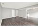Spacious living room featuring vinyl floors, fresh paint, and an open concept design at 8545 La Corrida Ct, Indianapolis, IN 46227