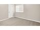 Bedroom with neutral walls, carpeting, and a large window for ample light at 8720 Yardley Ct # 108, Indianapolis, IN 46268