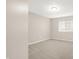Neutral bedroom featuring plush carpeting and a large window for natural light at 8720 Yardley Ct # 108, Indianapolis, IN 46268