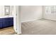 The bright bedroom features neutral walls, plush carpeting, and a window offering natural light at 8720 Yardley Ct # 108, Indianapolis, IN 46268