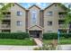 Well-maintained condo building with manicured landscaping and accessible entrance at 8720 Yardley Ct # 108, Indianapolis, IN 46268