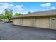Three garage spaces with neutral doors and walls provide secure parking and storage at 8720 Yardley Ct # 108, Indianapolis, IN 46268
