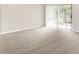 Bright living area with neutral carpet and sliding glass doors to outdoor space at 8720 Yardley Ct # 108, Indianapolis, IN 46268