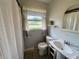Bathroom featuring a pedestal sink and striped window valance at 902 N Bauman St, Indianapolis, IN 46214