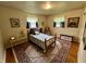 Bedroom with hardwood floors, decorative rug, and natural light at 902 N Bauman St, Indianapolis, IN 46214