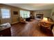 Inviting living room featuring a fireplace, hardwood floors, and plenty of natural light at 902 N Bauman St, Indianapolis, IN 46214