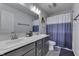 Bathroom featuring double sinks, a large mirror, and a shower-tub combination at 928 Ridge Rock Ln, Bargersville, IN 46106