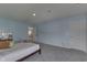 A spacious bedroom with plush carpeting and ample natural light creates a cozy retreat at 928 Ridge Rock Ln, Bargersville, IN 46106