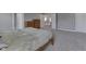 Spacious bedroom with a doorway, a wooden bed frame and plush carpet flooring at 928 Ridge Rock Ln, Bargersville, IN 46106
