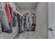 Organized walk-in closet with clothing racks and shelving for shoes and accessories at 928 Ridge Rock Ln, Bargersville, IN 46106