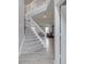 Open foyer with carpeted stairs, wood flooring, and views into the adjacent living room at 928 Ridge Rock Ln, Bargersville, IN 46106