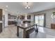 Open-concept kitchen featuring a center island, modern appliances, and a cozy dining area at 928 Ridge Rock Ln, Bargersville, IN 46106