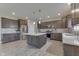 Modern kitchen features stainless appliances, an island, and sleek cabinets at 928 Ridge Rock Ln, Bargersville, IN 46106