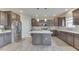 Beautiful kitchen features stainless appliances, an island, and modern cabinets at 928 Ridge Rock Ln, Bargersville, IN 46106