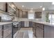 Well-equipped kitchen features stainless appliances and sleek countertop space at 928 Ridge Rock Ln, Bargersville, IN 46106