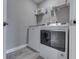 Laundry room with modern appliances and built-in shelving provides convenience and organization at 928 Ridge Rock Ln, Bargersville, IN 46106