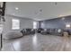 Spacious living room featuring a cozy seating arrangement and an accent wall at 928 Ridge Rock Ln, Bargersville, IN 46106