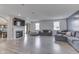 Bright living room featuring a fireplace, large windows, and sleek wood flooring at 928 Ridge Rock Ln, Bargersville, IN 46106