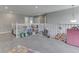 Bright, carpeted loft with white railing, neutral walls, and plenty of space for play and relaxation at 928 Ridge Rock Ln, Bargersville, IN 46106
